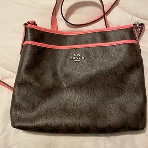 Brown/pink Coach crossbody bag.